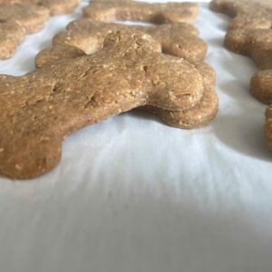 A Baking Sheet Displaying an Assortment of Dog Bone-Shaped Cookies